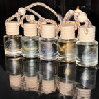 Set of small glass bottles with cork stoppers arranged in a basket on a reflective black surface.